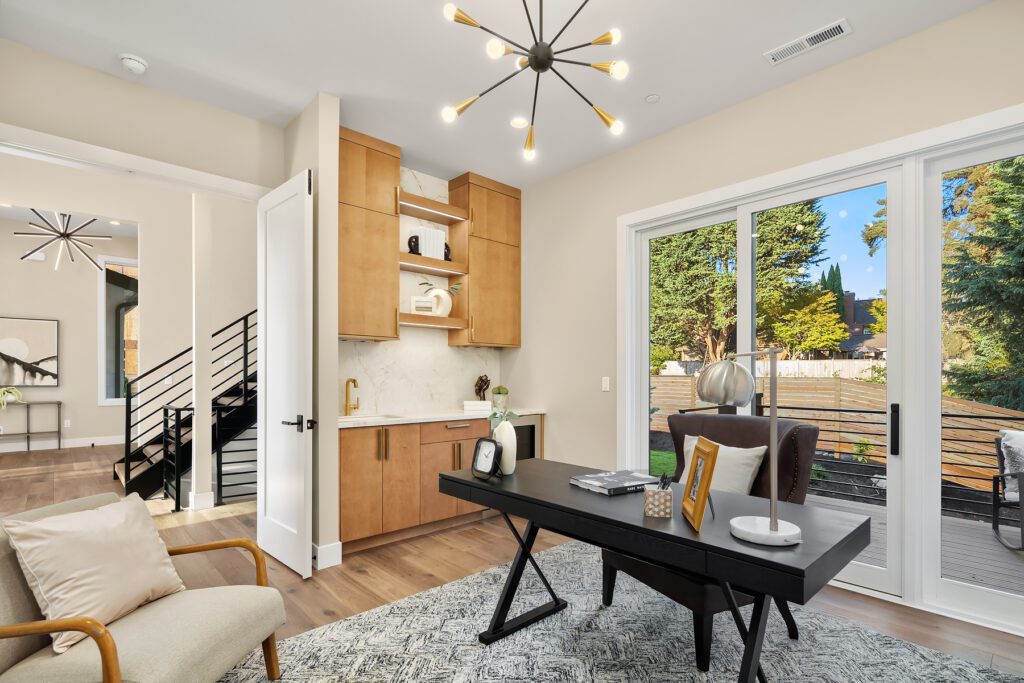Bright modern home office with stylish decor, large glass doors, and inviting natural light.