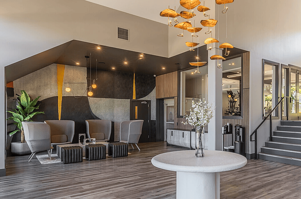 Contemporary lobby design featuring stylish furniture, artistic decor, and inviting seating areas.
