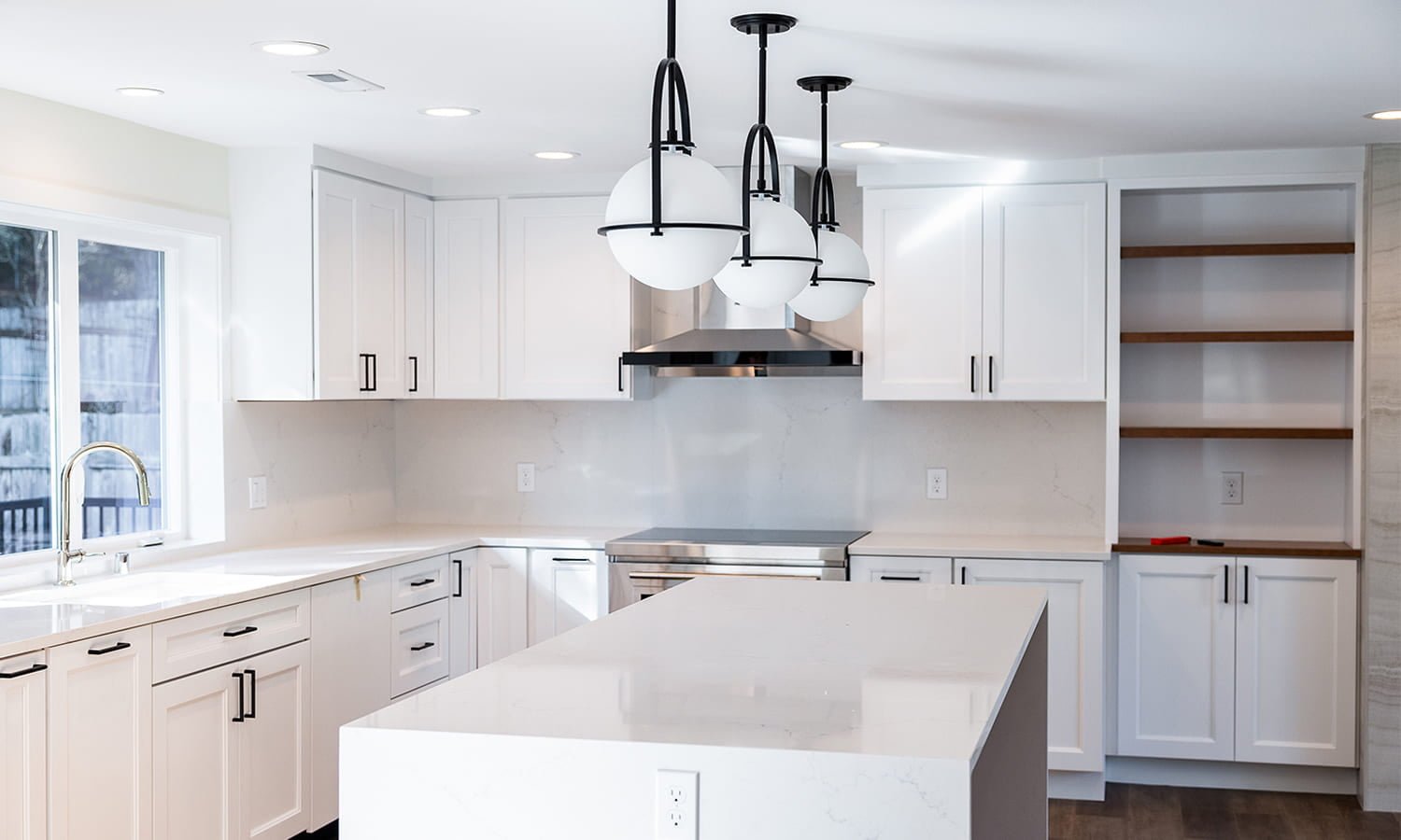 Contemporary L-shaped kitchen with white cabinets — Kirkland Home, Ariana Designs