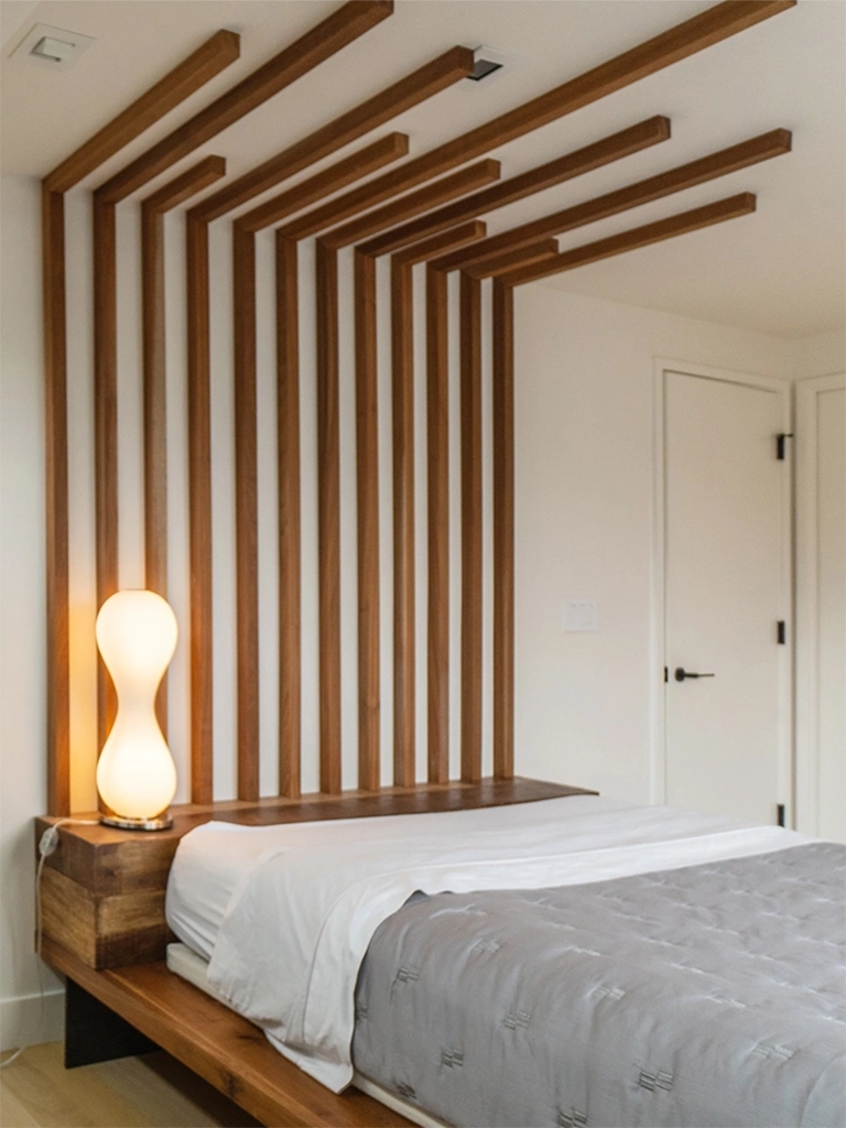 Minimalist bedroom design wooden slat headboard calming palette — Ariana Designs, Seattle floating home