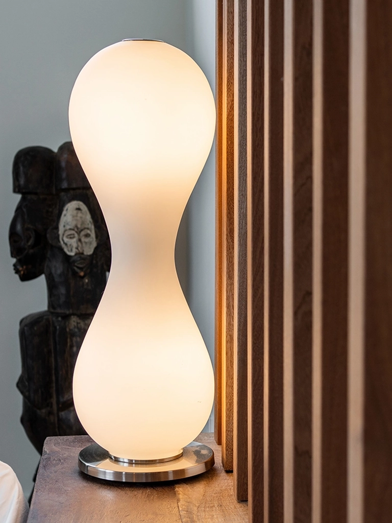 Modern lamp African-inspired sculpture polished wooden surface — Ariana Designs, Seattle floating home