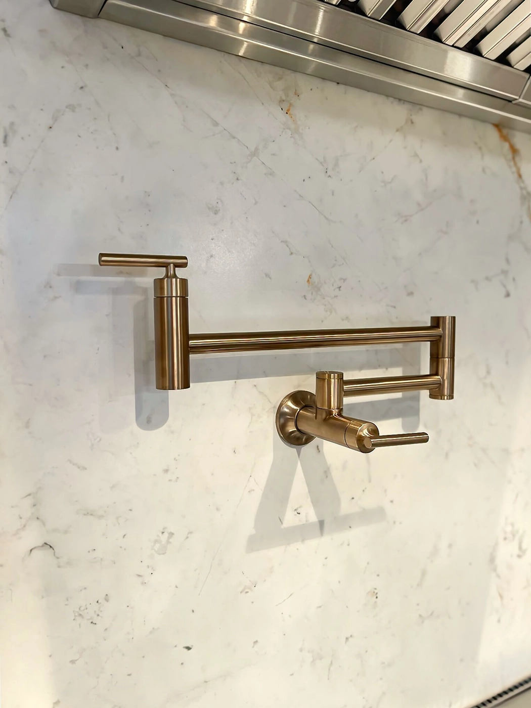 Elegant bronze faucet on marble countertop — Medina kitchen, dual-tone hardware detail, Ariana Designs