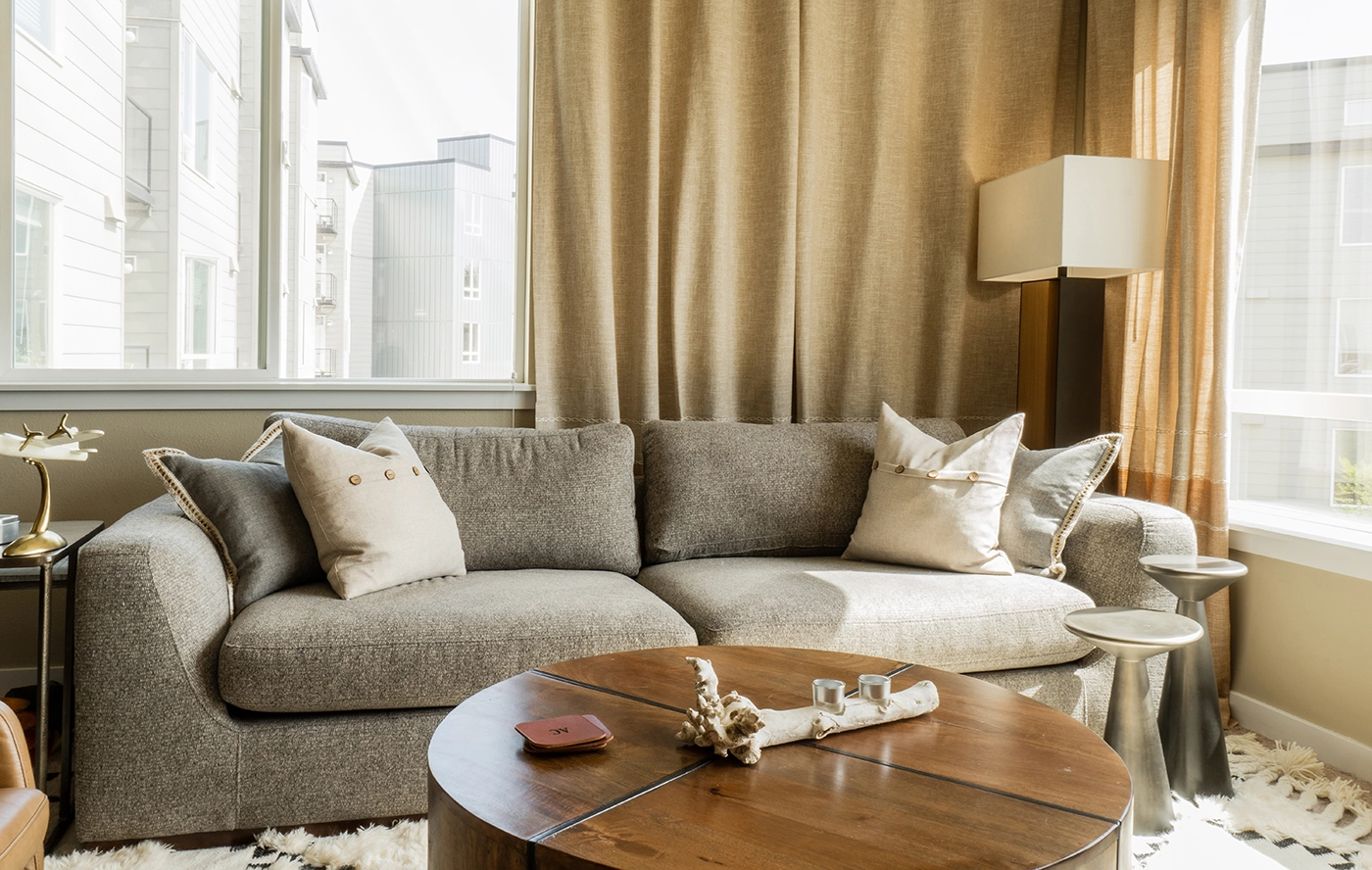 Modern urban living room with layered textures — Ariana Designs
