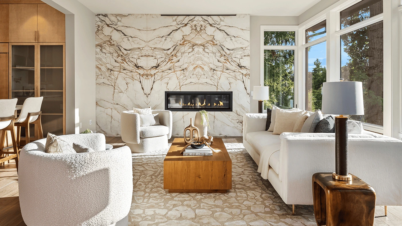 Elegant living room with marble fireplace and neutral palette — Ariana Designs, Bellevue