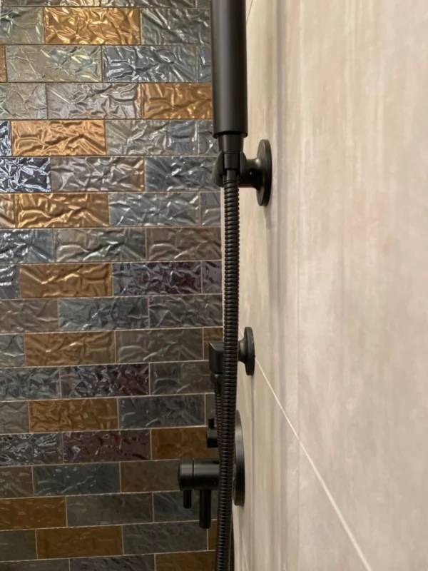 Modern black showerhead with tiled wall — Ariana Designs, Seattle