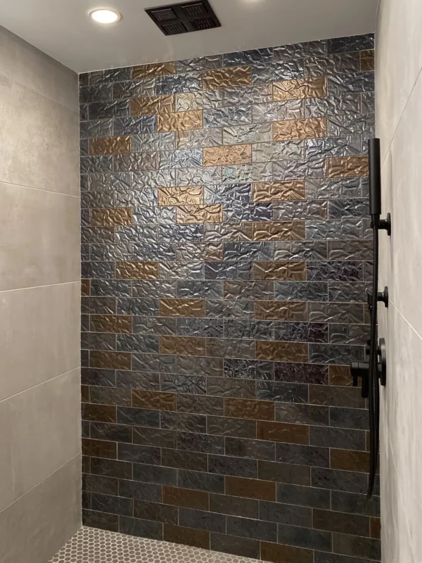 Modern shower with textured tiles and hexagonal flooring — Ariana Designs, Seattle