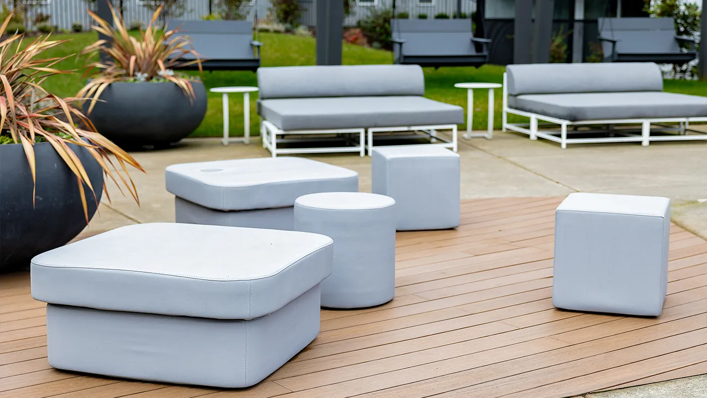 Modern outdoor lounge gray seating lush greenery — Ariana Designs, Bellevue Washington