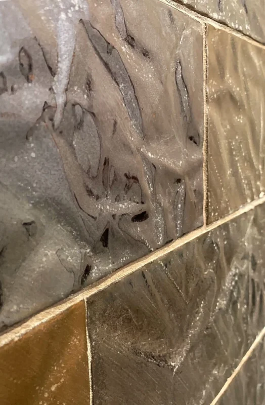 Interlocking gray and brown textured tile wall — Ariana Designs