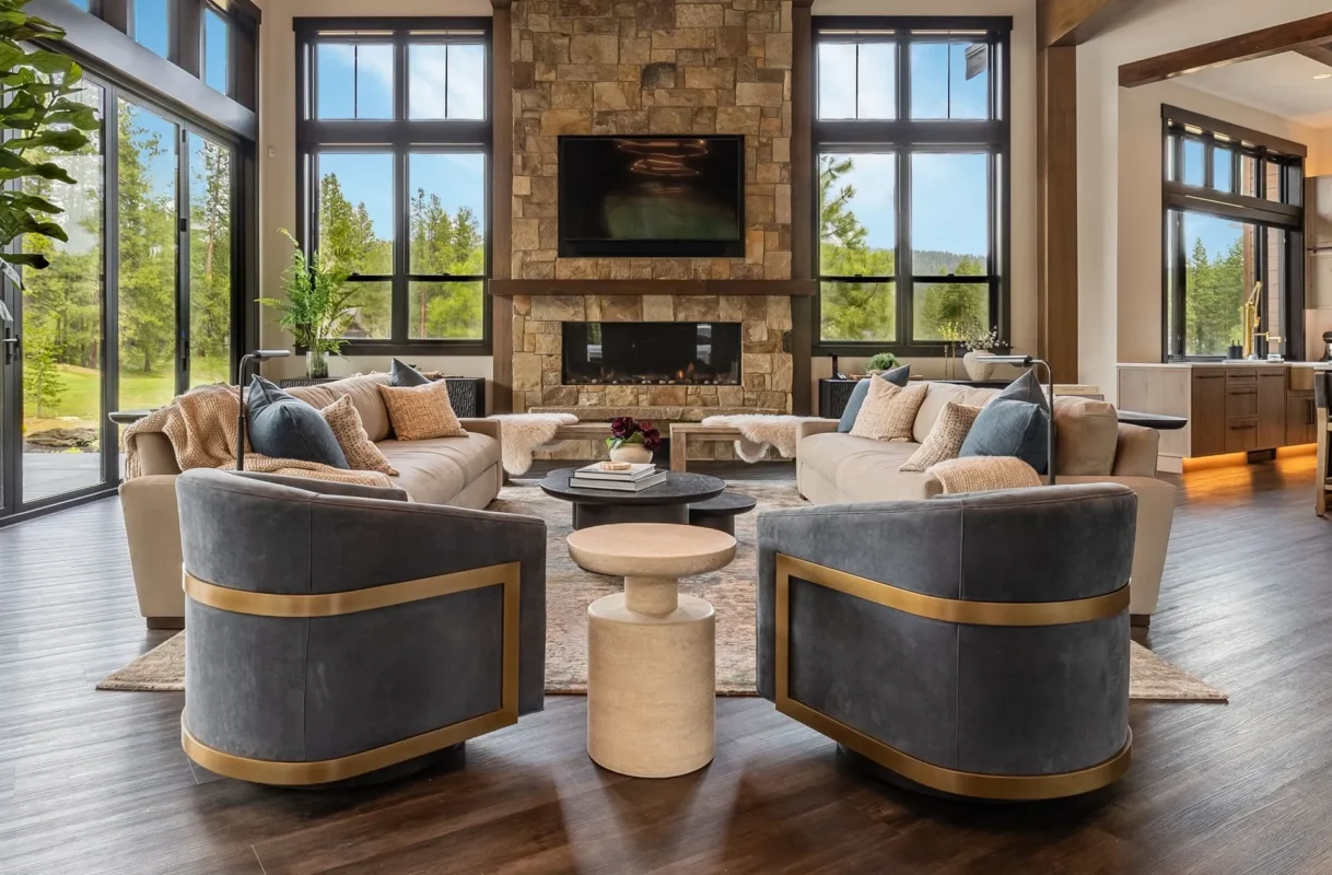 Luxury Interior Design Bellevue – Modern Living Room With Stone Fireplace And Forest Views — Ariana Designs & Interiors
