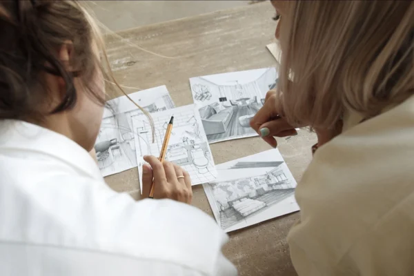 Interior designer discussing ideas with a client during a consultation session at Ariana Designs and Architecture.