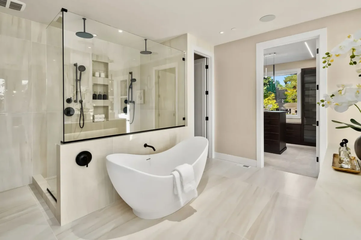 Elegant modern bathroom featuring a freestanding bathtub and stylish shower for ultimate relaxation.