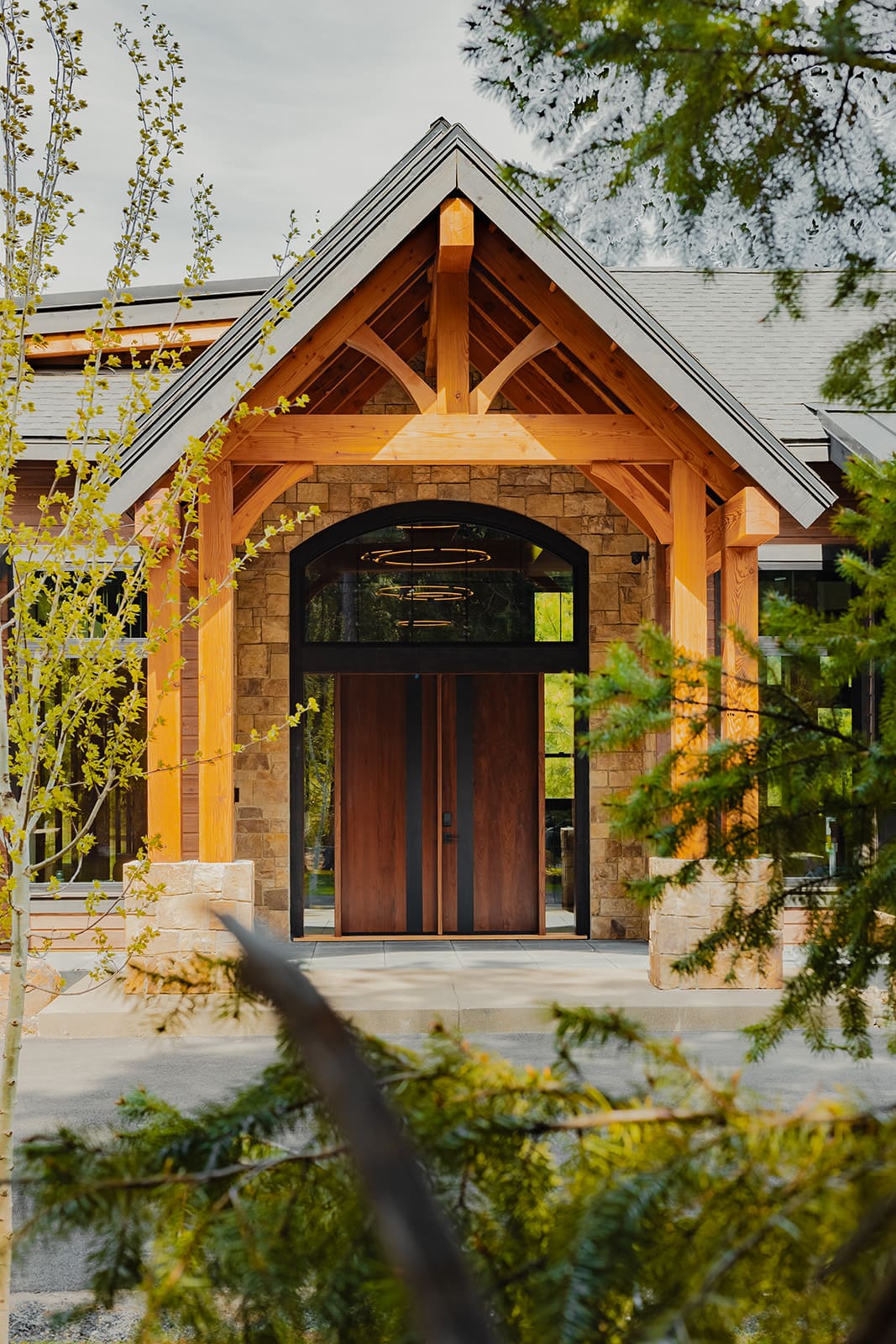 Monumental pivot door entry — Ariana Designs & Interiors, Suncadia grand retreat