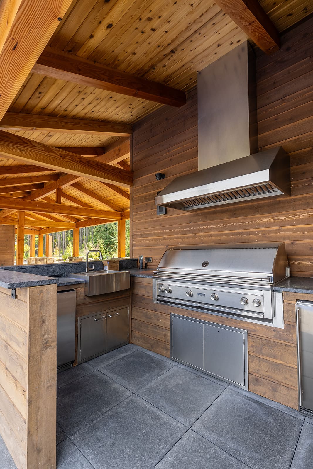 Grand retreat outdoor kitchen — Ariana Designs & Interiors, Suncadia estate