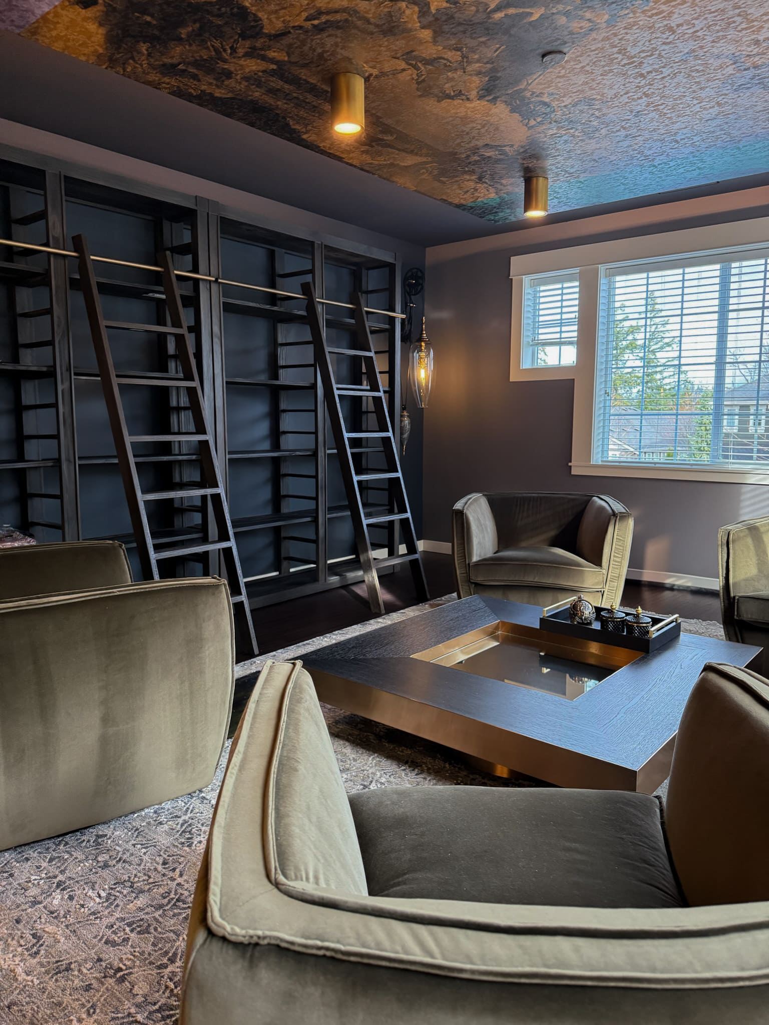 Chic modern lounge with plush seating and elegant lighting — Kirkland home library
