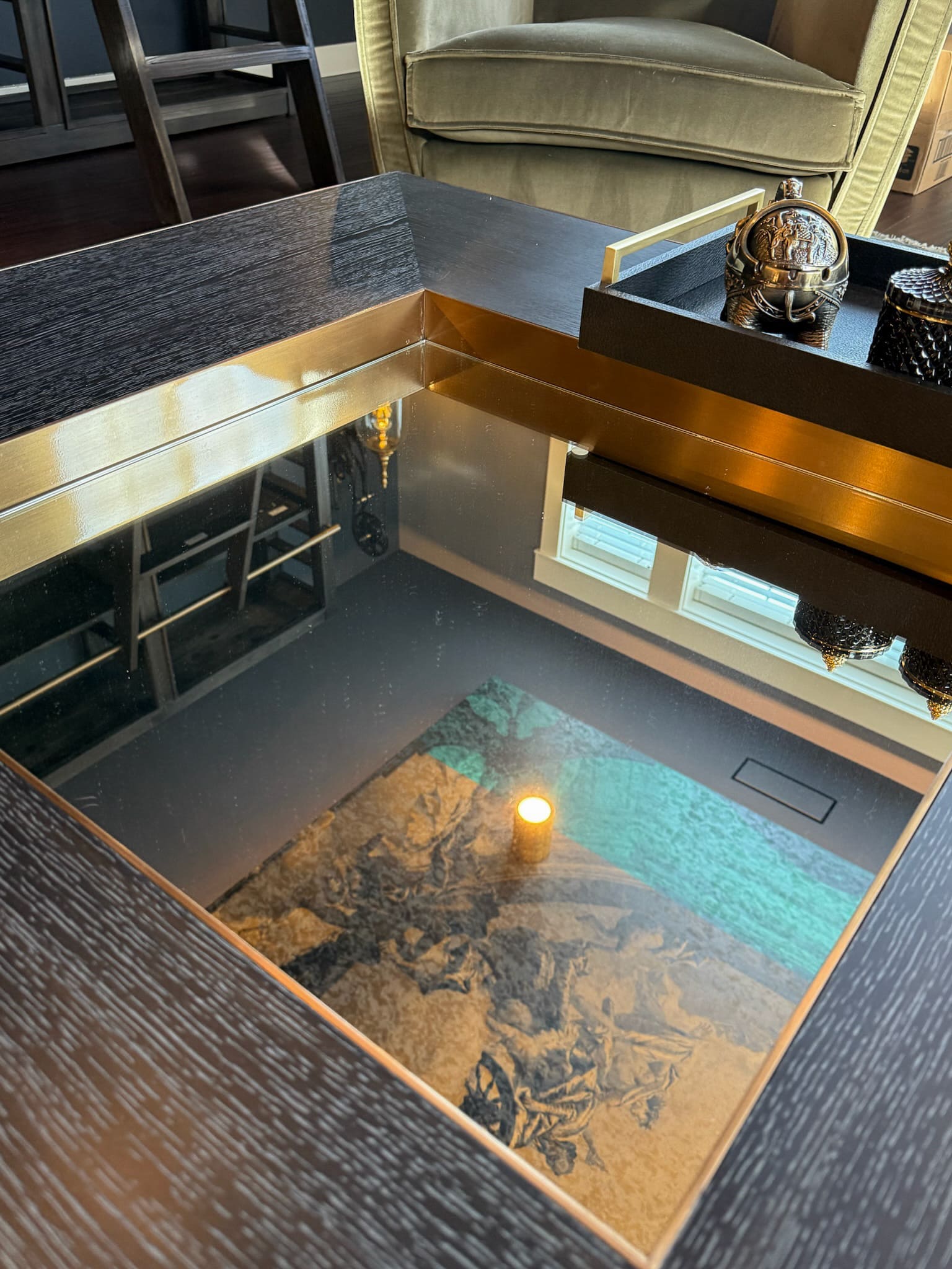 Elegant mirror-inset coffee table reflecting ceiling mural — Kirkland artful library, Ariana Designs