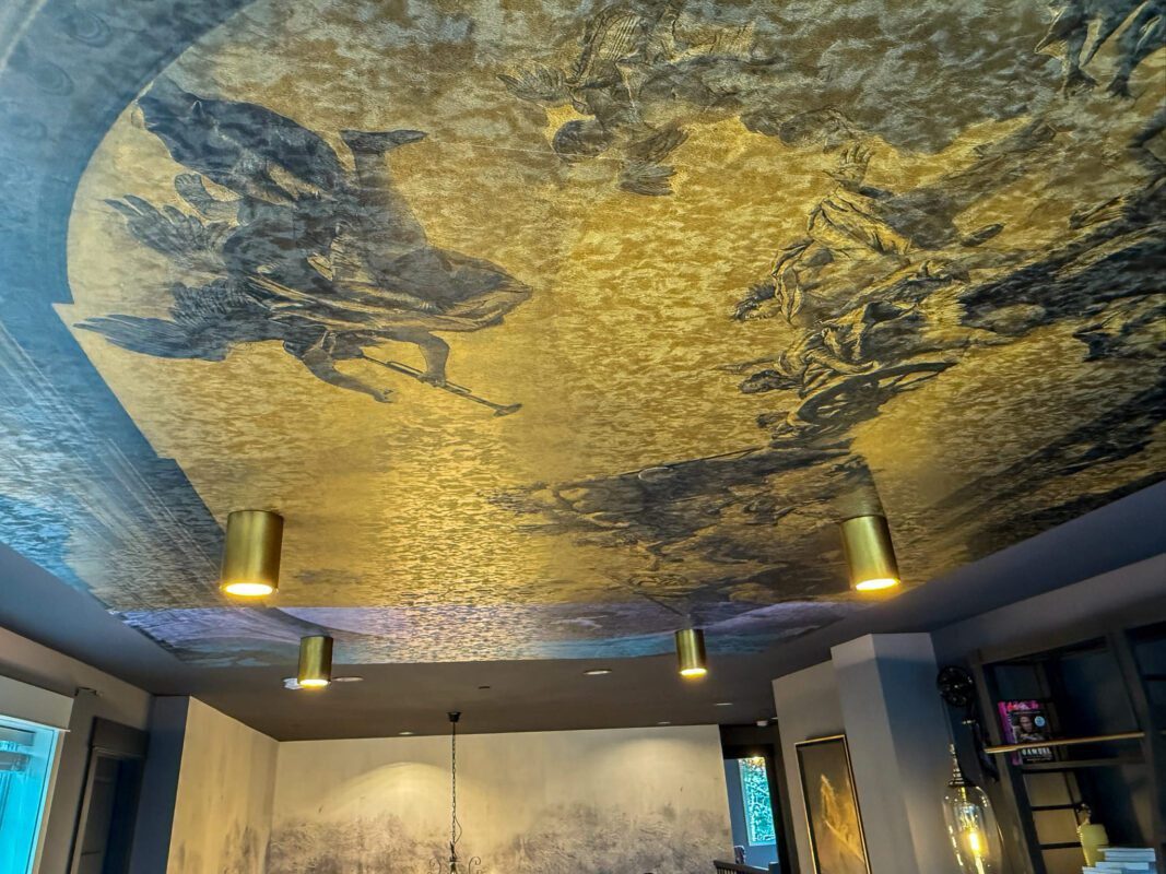 Stylish luxury ceiling design featuring intricate mural and modern lighting for elegant interiors.