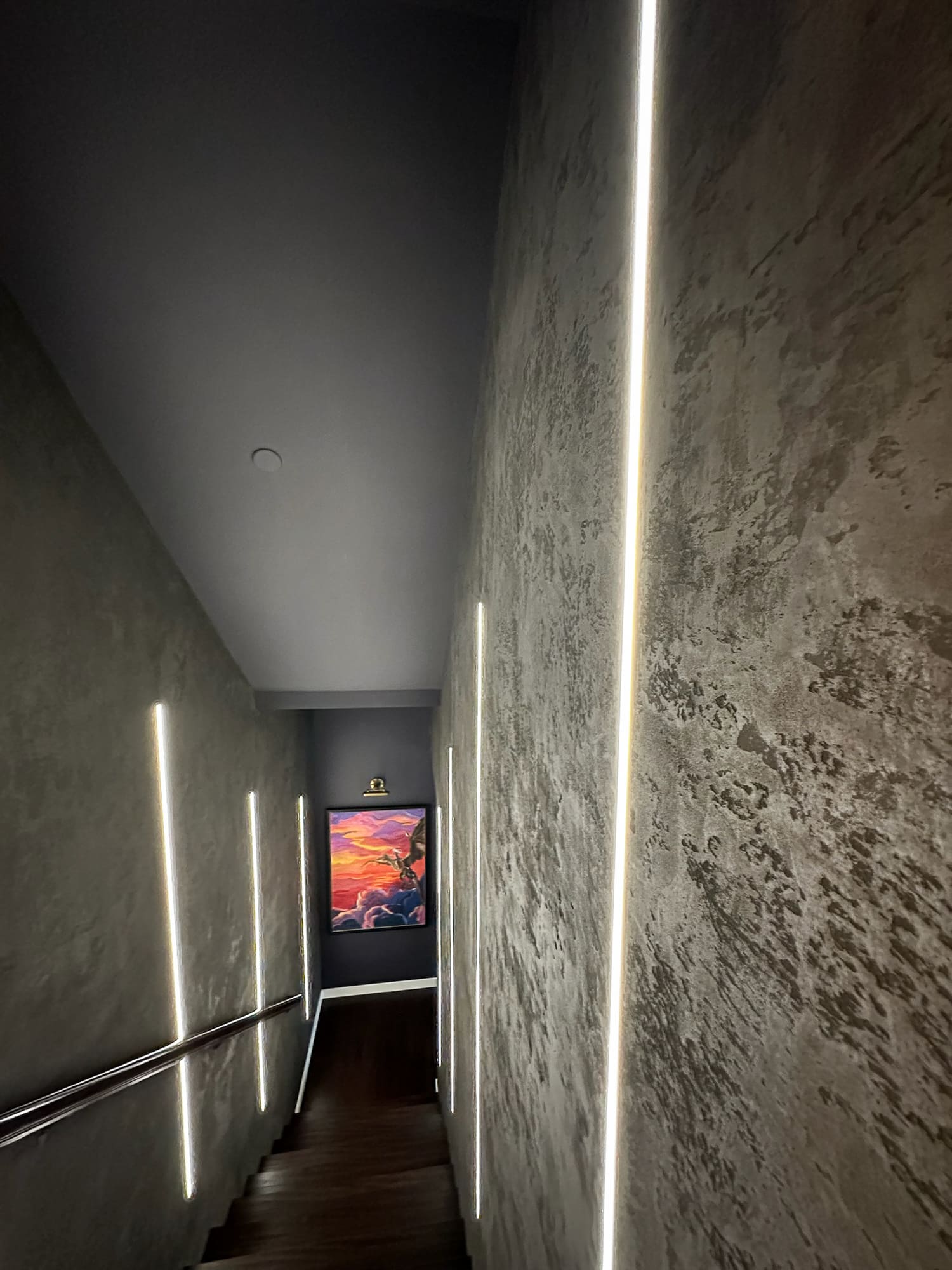 Modern staircase design with custom paneling — Ariana Designs