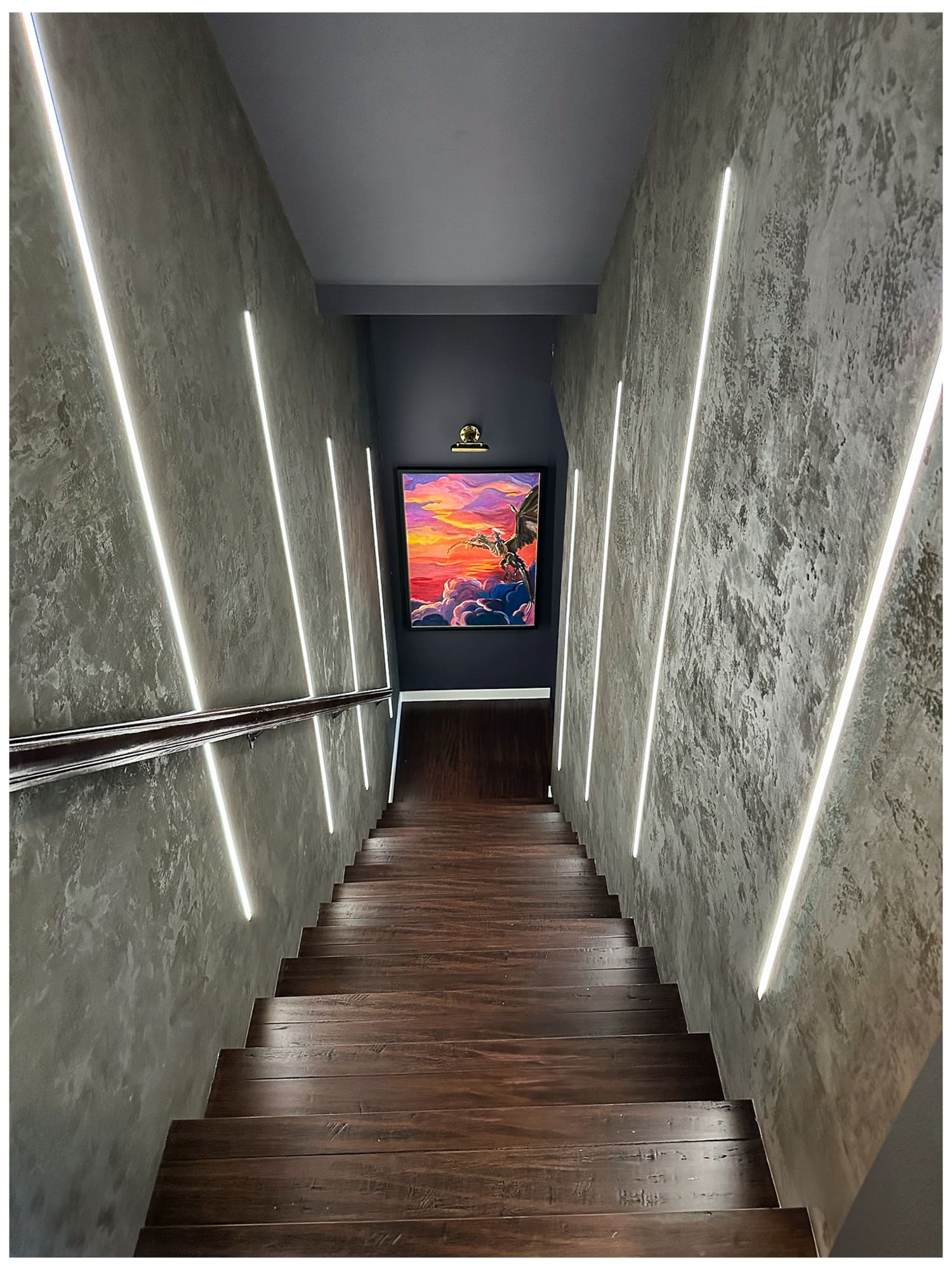 Stylish custom staircase with dark walls — Ariana Designs