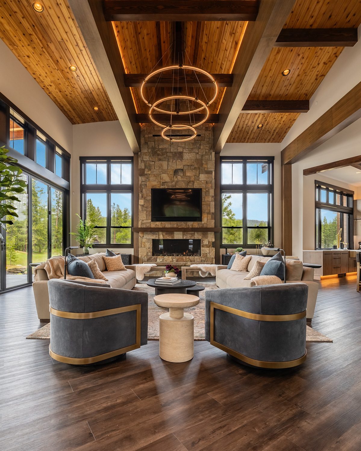 Floor-to-ceiling stone fireplace with integrated TV wall — Luxury Suncadia Family Room Design, Ariana Designs & Interiors