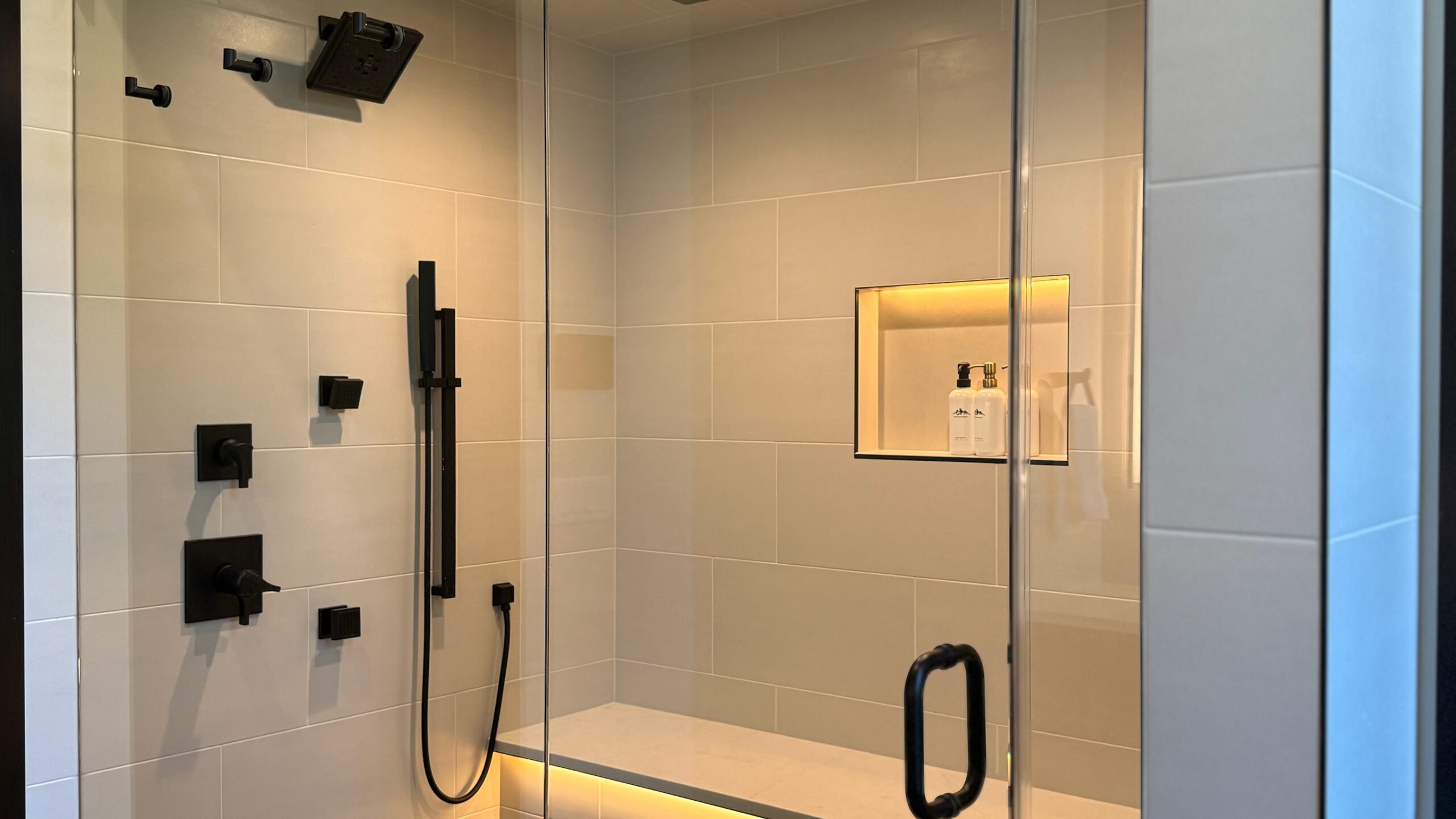 Full walk-in shower with heated LED bench — Ariana Designs & Interiors, Suncadia