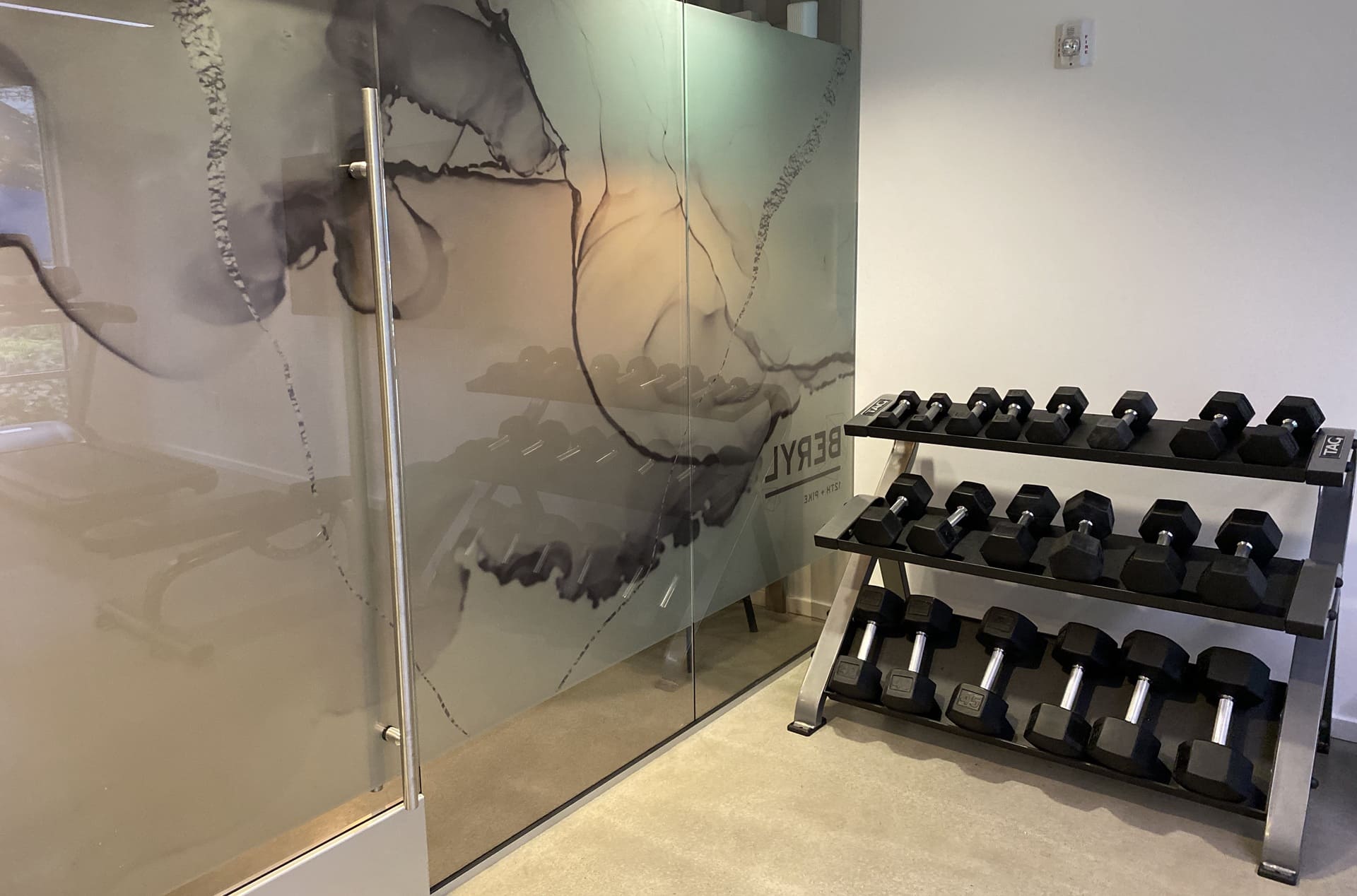 Beryl fitness room and glass partition — Ariana Designs & Interiors, Seattle