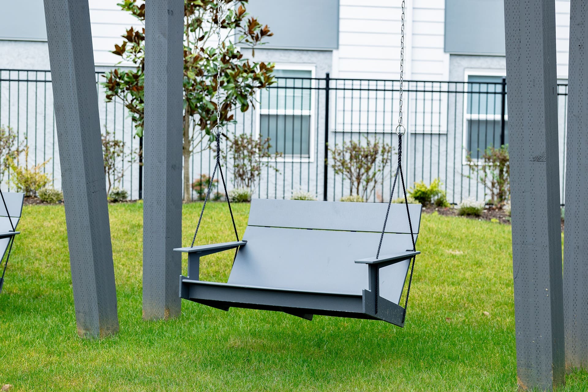 Bellevue Clubhouse swing outdoor lounge area — Ariana Designs, Bellevue Washington