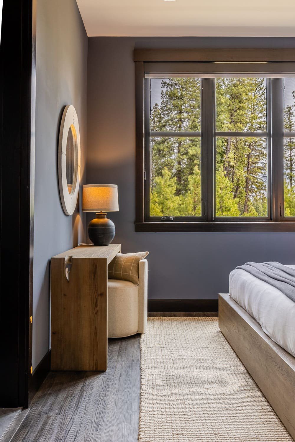 Mountain art guest bedroom with camel leather bed — Suncadia