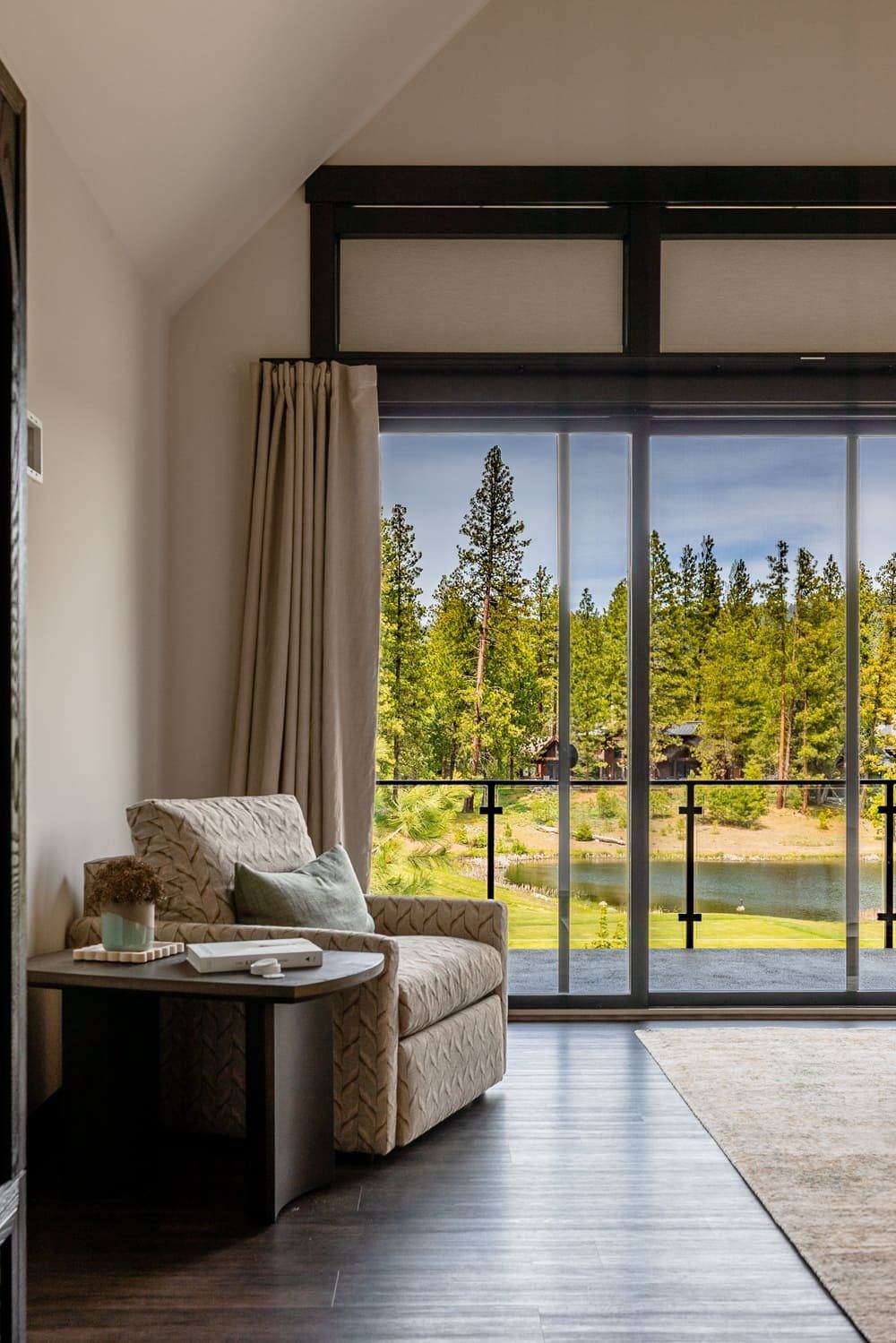 Primary bedroom reading nook with pond and forest views — Suncadia
