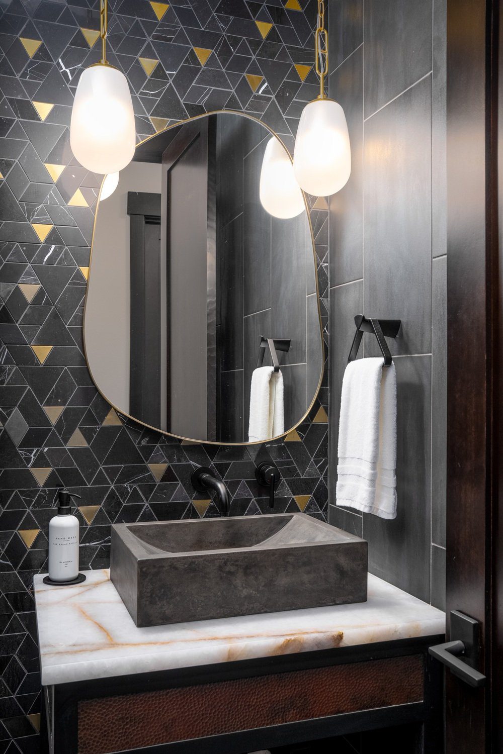 Custom vanity with white onyx countertop and hammered copper drawer front — Ariana Designs, Suncadia