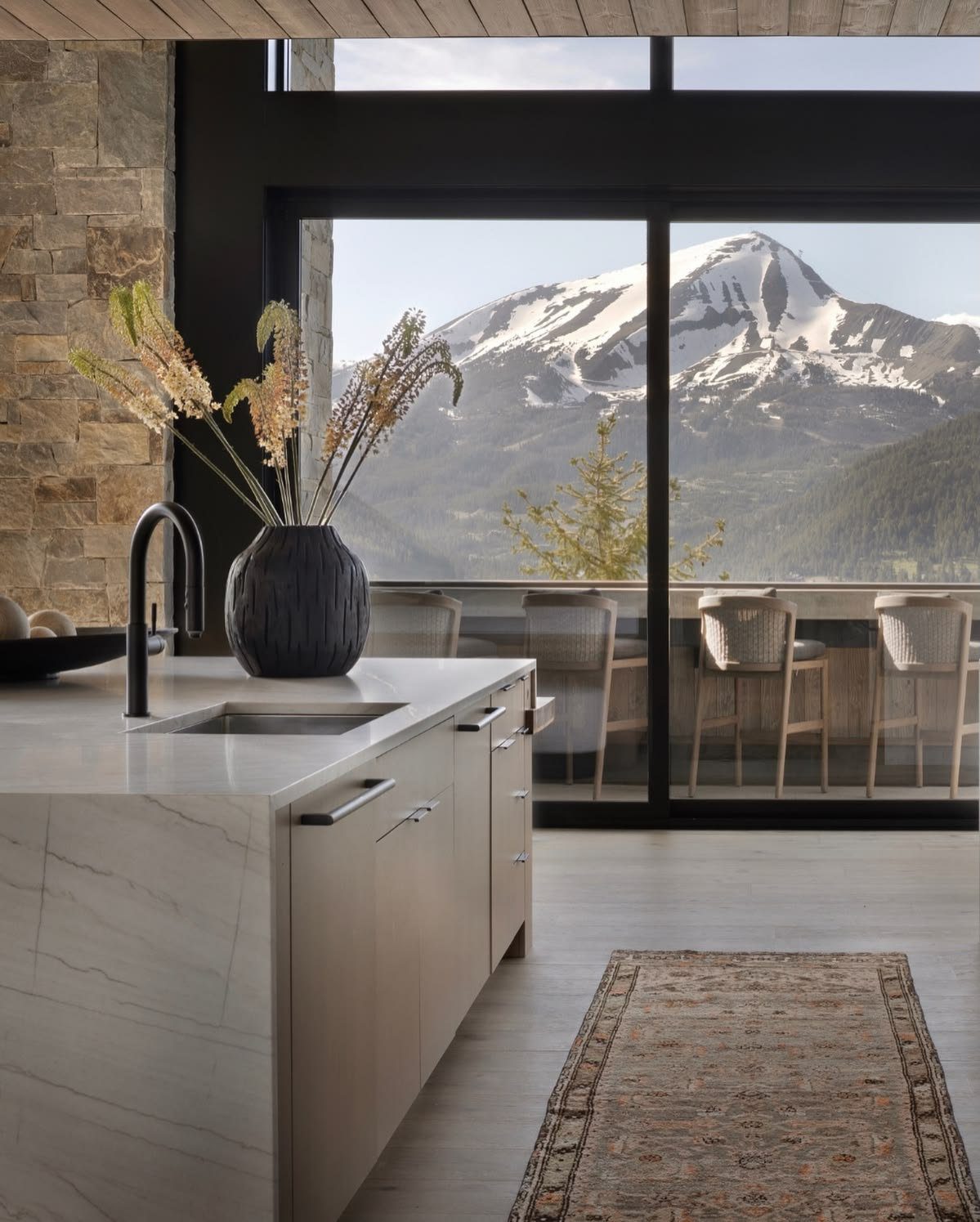 Luxury kitchen with large island, custom cabinetry, and marble countertops in a Seattle-area home